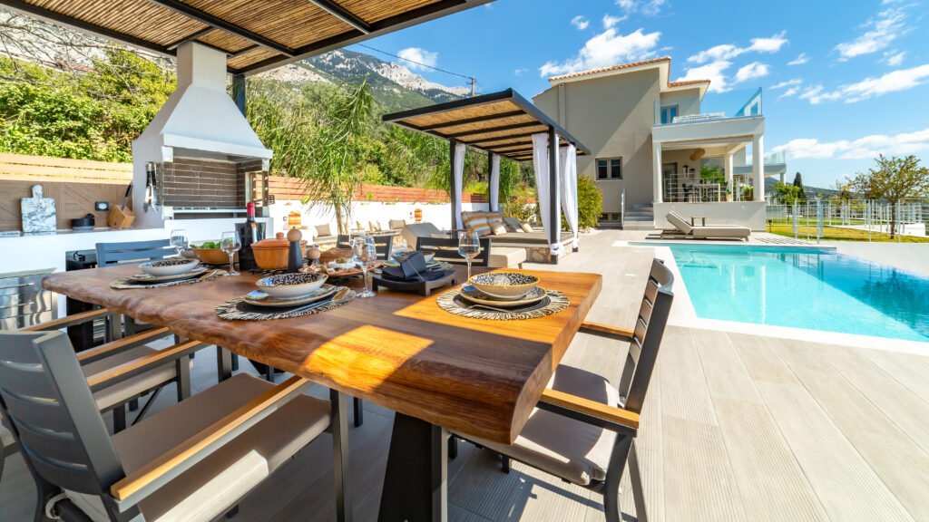 Image depicting outside dining area with pool